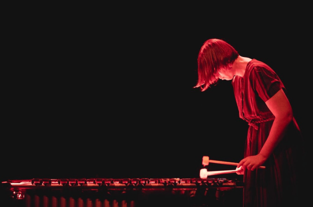 Photo of Sarah Hennies in performance by GlassHertzzPhoto.